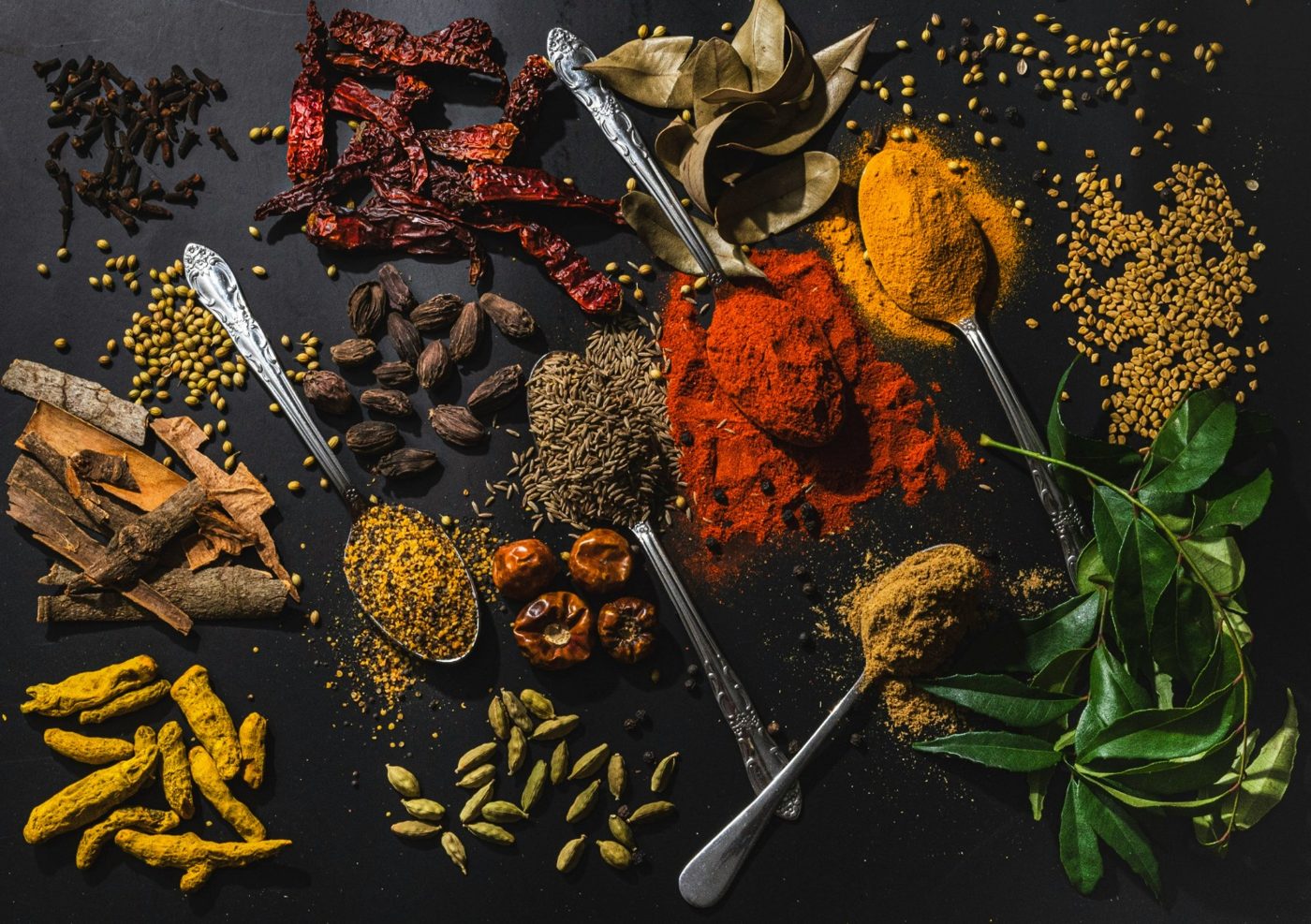 A flat lay of the dried herbs, roots and spices used in Real Makhoi products