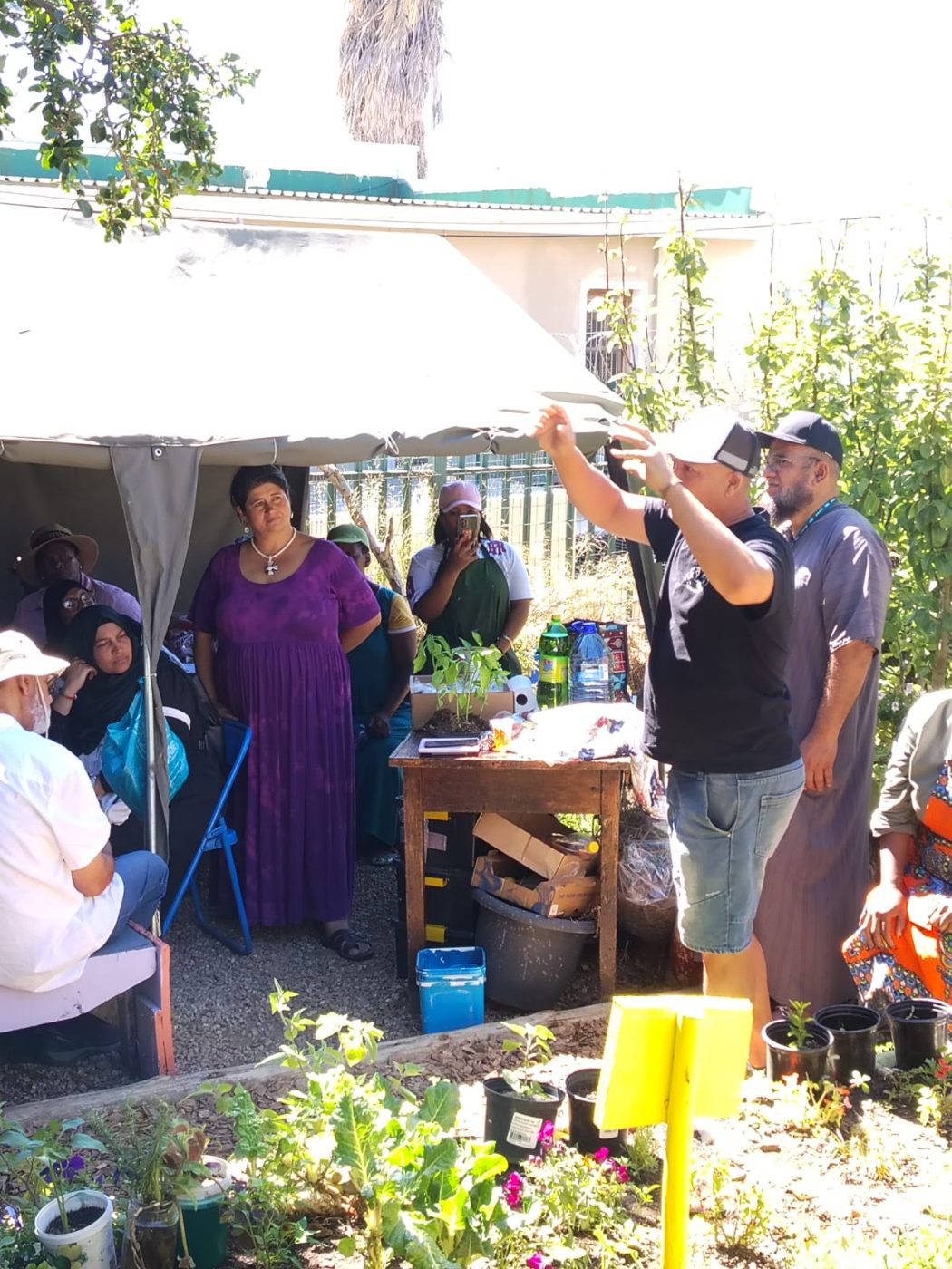 Talking about the plants with visitors at a garden open day